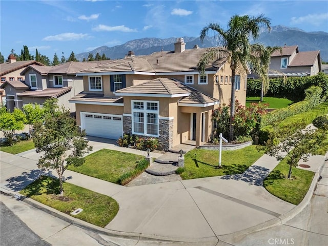 11376 Starlight Dr, Rancho Cucamonga, CA 91701 - view of front facade with stucco siding, a mountain view, concrete driveway, and an attached garage