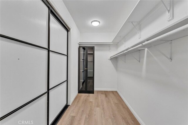11376 Starlight Dr, Rancho Cucamonga, CA 91701 - spacious closet with light wood-type flooring
