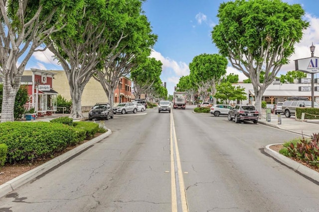 1003 Overton Ct, Tustin, CA 92780 - view of asphalt road featuring curbs and street lighting