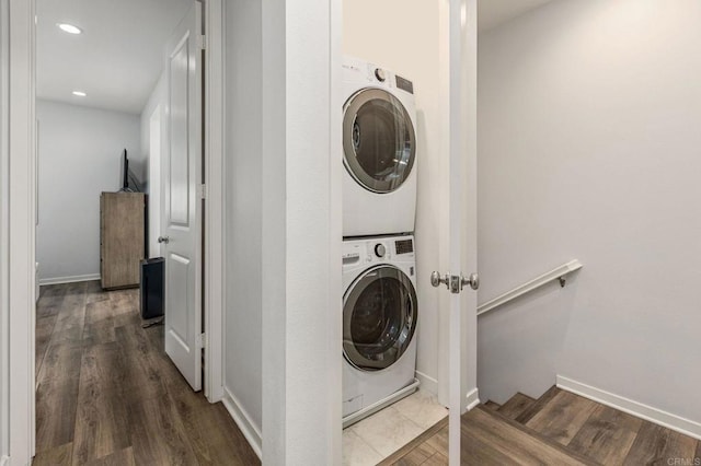 1003 Overton Ct, Tustin, CA 92780 - laundry area with stacked washer / dryer, wood finished floors, recessed lighting, and baseboards