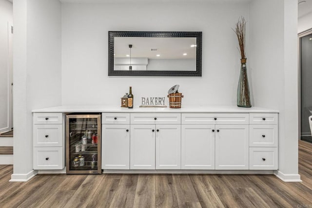 1003 Overton Ct, Tustin, CA 92780 - indoor dry bar featuring wine cooler, wood finished floors, and baseboards