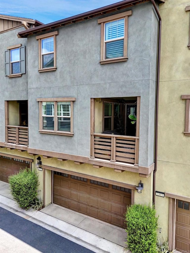 1003 Overton Ct, Tustin, CA 92780 - view of front of property with stucco siding and a garage
