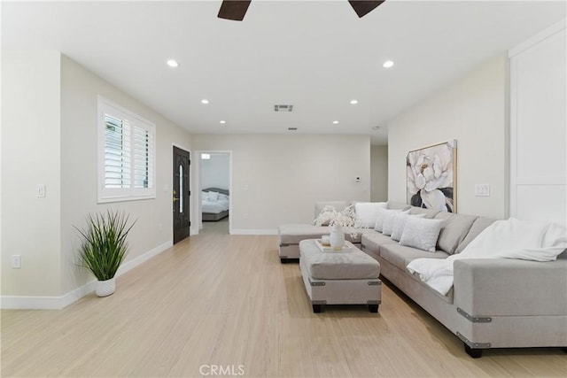 1217 W 77th St, Los Angeles, CA 90044 - living room with light wood-type flooring, recessed lighting, ceiling fan, and baseboards