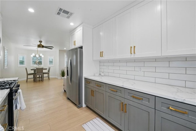 1217 W 77th St, Los Angeles, CA 90044 - kitchen featuring appliances with stainless steel finishes, gray cabinetry, tasteful backsplash, white cabinetry, and recessed lighting