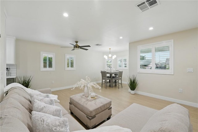 1217 W 77th St, Los Angeles, CA 90044 - living area with healthy amount of natural light, light wood finished floors, and recessed lighting
