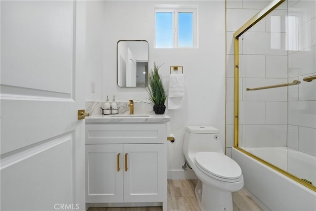 1217 W 77th St, Los Angeles, CA 90044 - bathroom featuring vanity, toilet, and shower / bath combination with glass door
