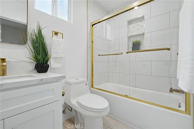 1217 W 77th St, Los Angeles, CA 90044 - full bath with vanity, toilet, and shower / bath combination with glass door