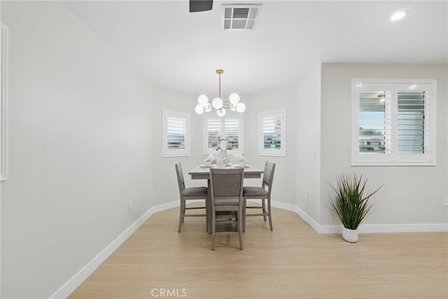 1217 W 77th St, Los Angeles, CA 90044 - dining area with light wood-type flooring, baseboards, a chandelier, and recessed lighting