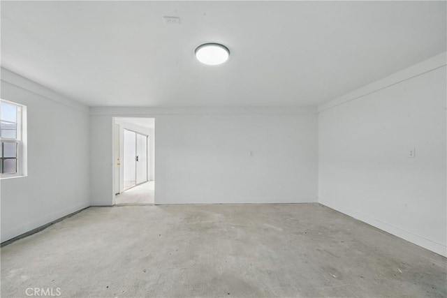 1217 W 77th St, Los Angeles, CA 90044 - spare room featuring concrete floors and baseboards