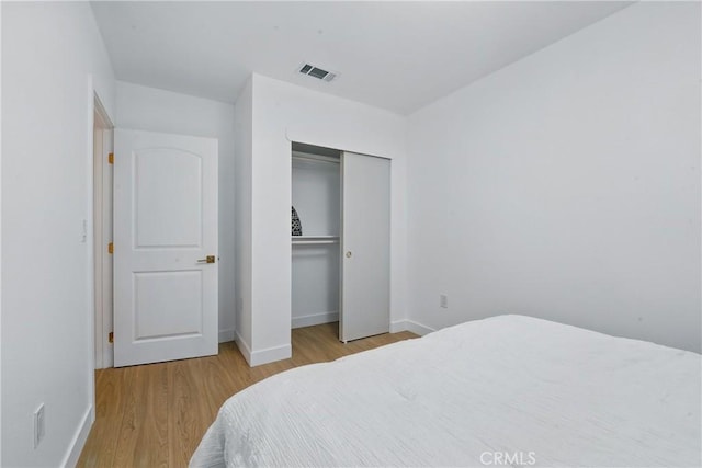 1217 W 77th St, Los Angeles, CA 90044 - bedroom with wood finished floors and baseboards