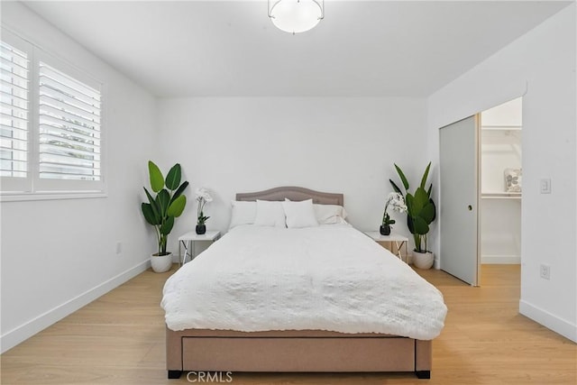 1217 W 77th St, Los Angeles, CA 90044 - bedroom featuring light wood-type flooring and baseboards