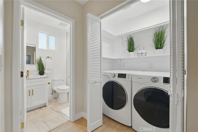 1217 W 77th St, Los Angeles, CA 90044 - laundry area with separate washer and dryer and baseboards