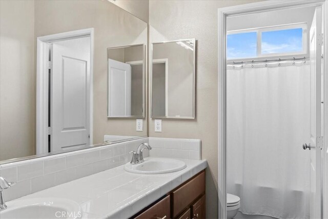 1472 Coyote Ln, Calimesa, CA 92320 - bathroom with double vanity, toilet, and shower / tub combo