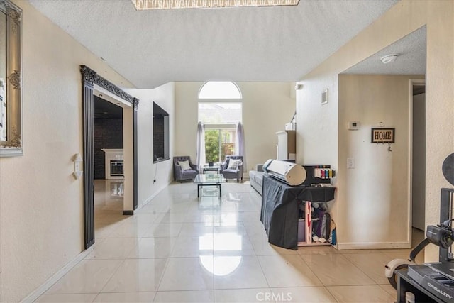 507 Coudures Way, Perris, CA 92571 - corridor featuring a textured ceiling, light tile patterned floors, a textured wall, and baseboards