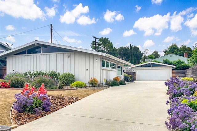 50 Quinta Vista Dr, Thousand Oaks, CA 91362 - view of front of property with a garage, board and batten siding, and an outdoor structure