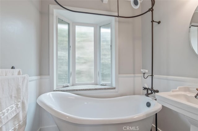 50 Quinta Vista Dr, Thousand Oaks, CA 91362 - bathroom with a freestanding tub and a wainscoted wall