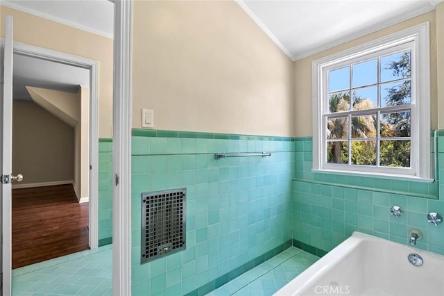 15454 Sutton St, Sherman Oaks, CA 91403 - bathroom with ornamental molding, a garden tub, tile walls, wainscoting, and wood finished floors