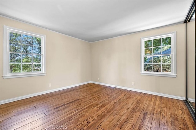 15454 Sutton St, Sherman Oaks, CA 91403 - empty room with hardwood / wood-style flooring, baseboards, and ornamental molding