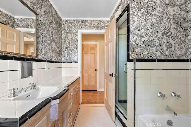 15454 Sutton St, Sherman Oaks, CA 91403 - full bath featuring wallpapered walls, vanity, a shower with door, a bath, and ornamental molding