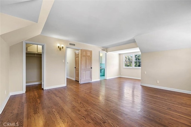 15454 Sutton St, Sherman Oaks, CA 91403 - unfurnished living room with wood finished floors, baseboards, and vaulted ceiling