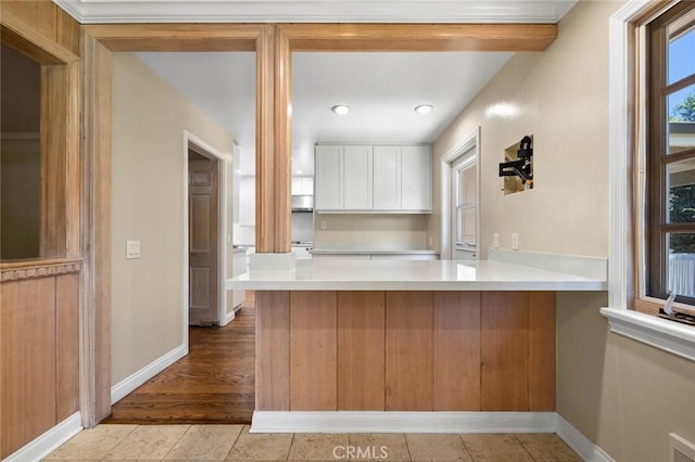 15454 Sutton St, Sherman Oaks, CA 91403 - kitchen featuring white cabinets, baseboards, a peninsula, light countertops, and recessed lighting