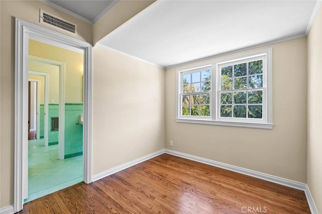 15454 Sutton St, Sherman Oaks, CA 91403 - empty room featuring wood finished floors, ornamental molding, and baseboards