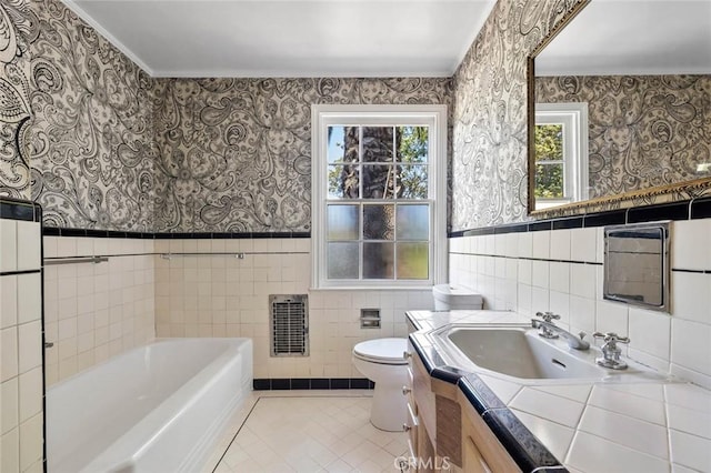 15454 Sutton St, Sherman Oaks, CA 91403 - full bathroom with vanity, a garden tub, tile patterned floors, wallpapered walls, and tile walls