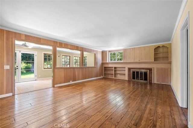 15454 Sutton St, Sherman Oaks, CA 91403 - unfurnished living room with hardwood / wood-style flooring, ornamental molding, a fireplace, baseboards, and built in features