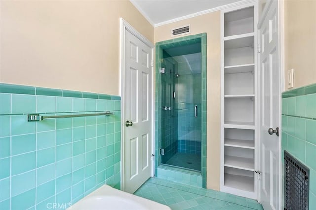15454 Sutton St, Sherman Oaks, CA 91403 - full bath featuring tile walls, a shower stall, tile patterned flooring, ornamental molding, and a spacious closet