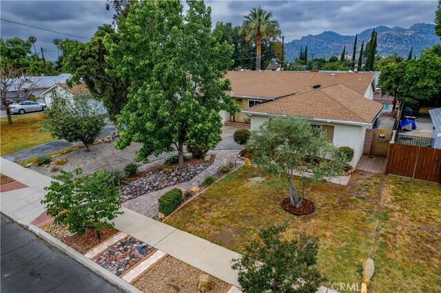 10425 Hillview Ave, Chatsworth, CA 91311 - view of front facade with a mountain view, stucco siding, and a gate