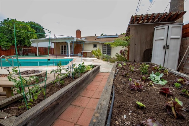 10425 Hillview Ave, Chatsworth, CA 91311 - view of pool with a fenced backyard, a vegetable garden, and a patio