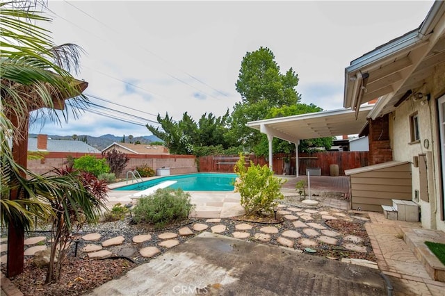 10425 Hillview Ave, Chatsworth, CA 91311 - view of swimming pool featuring a patio, a fenced backyard, and a mountain view
