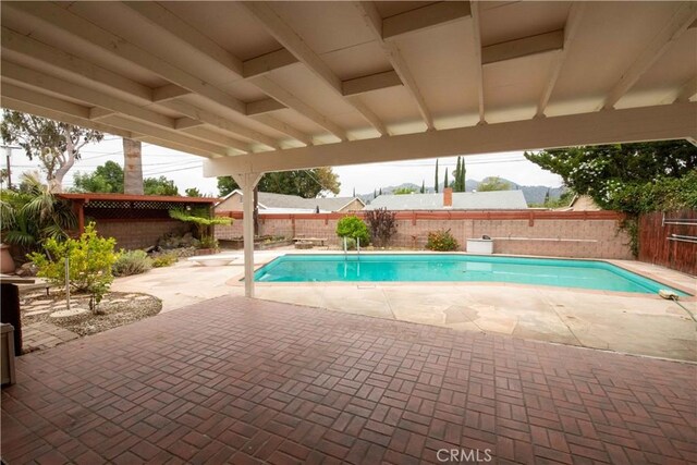 10425 Hillview Ave, Chatsworth, CA 91311 - view of pool featuring a fenced backyard, a patio area, and a diving board