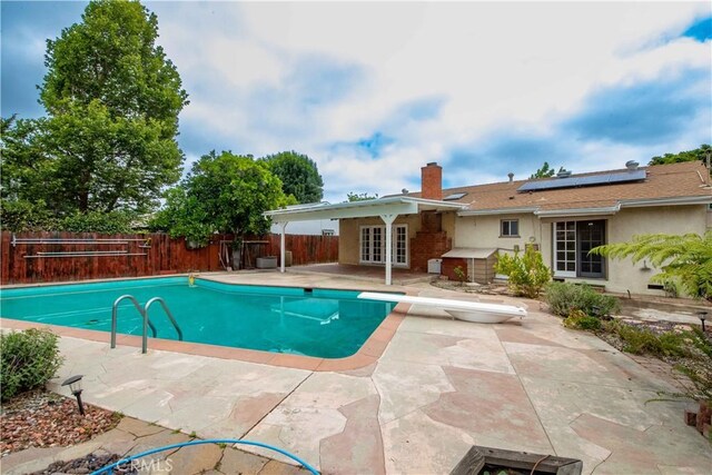10425 Hillview Ave, Chatsworth, CA 91311 - view of pool with french doors, a patio, a diving board, and a fenced backyard