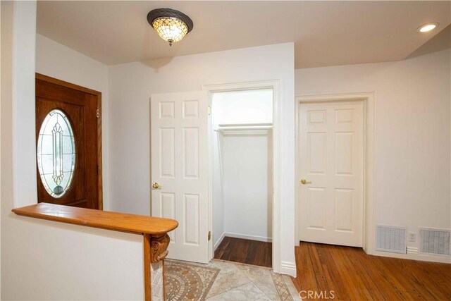 10425 Hillview Ave, Chatsworth, CA 91311 - foyer entrance featuring light wood-style flooring and baseboards