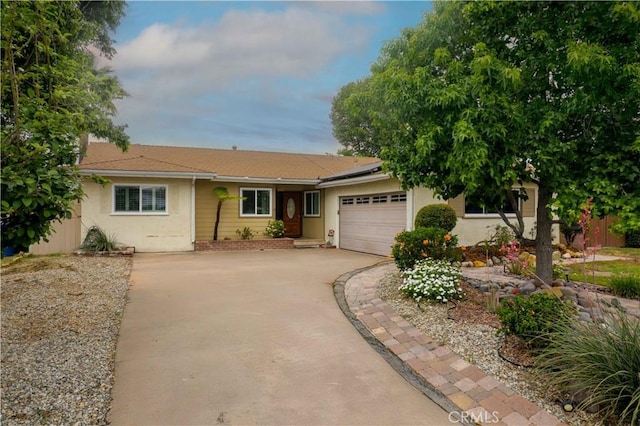 10425 Hillview Ave, Chatsworth, CA 91311 - single story home with driveway, solar panels, an attached garage, and stucco siding