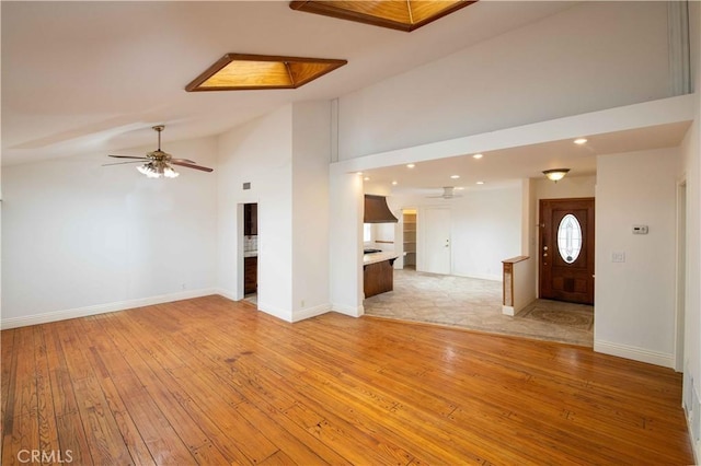 10425 Hillview Ave, Chatsworth, CA 91311 - unfurnished living room featuring ceiling fan, light wood-type flooring, recessed lighting, and high vaulted ceiling
