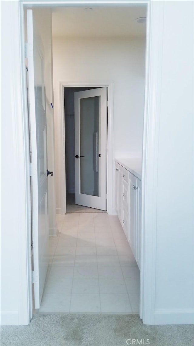 163 Lantana Dr, Stanton, CA 90680 - corridor featuring baseboards and light tile patterned flooring