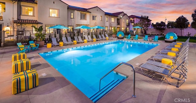 163 Lantana Dr, Stanton, CA 90680 - pool at dusk with a community pool and a patio area