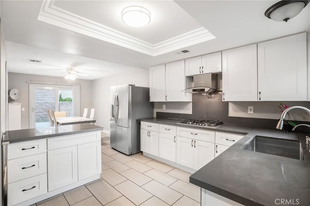 2131 Dublin Ln Unit 3, Diamond Bar, CA 91765 - kitchen with a sink, stainless steel appliances, a tray ceiling, dark countertops, and range hood