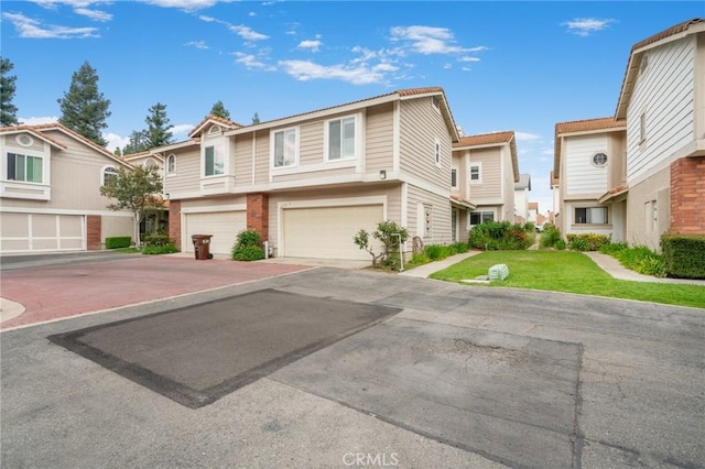 2131 Dublin Ln Unit 3, Diamond Bar, CA 91765 - townhome / multi-family property featuring an attached garage, driveway, a residential view, and a front lawn