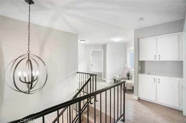 2131 Dublin Ln Unit 3, Diamond Bar, CA 91765 - hall featuring an upstairs landing, a chandelier, light wood-type flooring, and baseboards