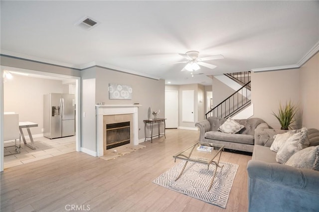 2131 Dublin Ln Unit 3, Diamond Bar, CA 91765 - living area with ceiling fan, stairs, ornamental molding, light wood finished floors, and baseboards