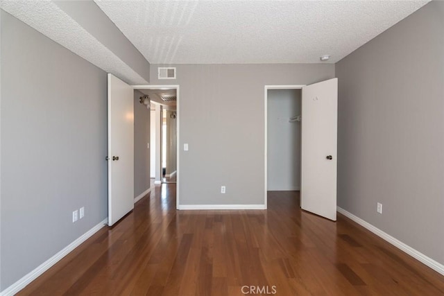 1422 Rock Glen Ave Unit 210, Glendale, CA 91205 - unfurnished bedroom featuring wood finished floors, baseboards, a textured ceiling, and a closet