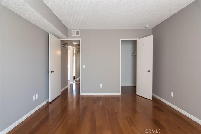 1422 Rock Glen Ave Unit 210, Glendale, CA 91205 - unfurnished bedroom with wood finished floors, a closet, and a textured ceiling
