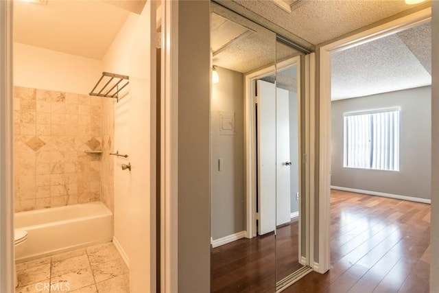 1422 Rock Glen Ave Unit 210, Glendale, CA 91205 - full bath with baseboards and bathtub / shower combination