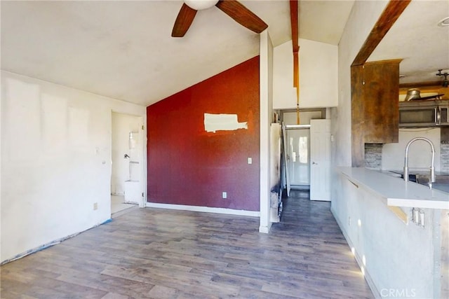 60220 Chalet Dr, Mountain Center, CA 92561 - kitchen featuring stainless steel microwave, a ceiling fan, a sink, wood finished floors, and beamed ceiling