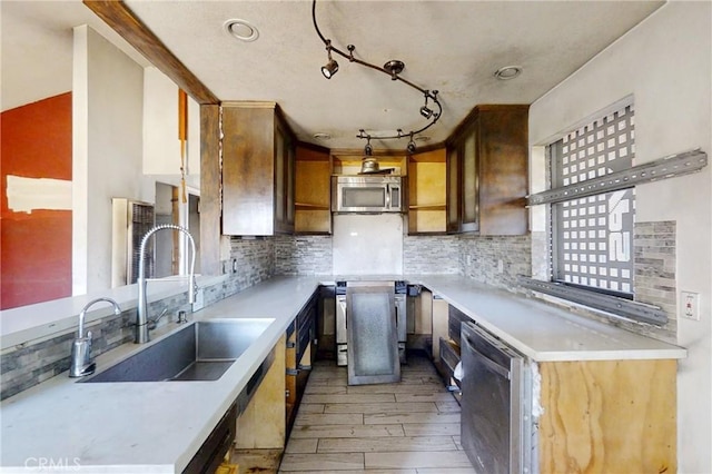 60220 Chalet Dr, Mountain Center, CA 92561 - kitchen with a sink, stainless steel appliances, light wood-type flooring, and decorative backsplash
