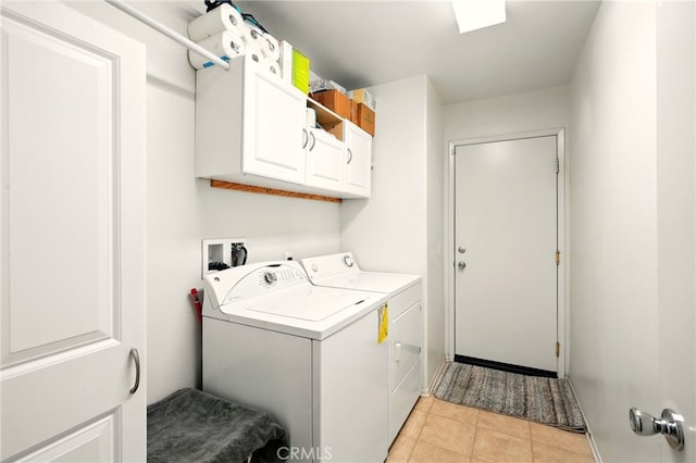 6875 Adainville Dr, Palmdale, CA 93552 - washroom featuring cabinet space, washer and dryer, and light tile patterned floors