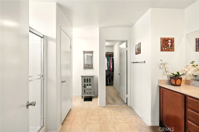 6875 Adainville Dr, Palmdale, CA 93552 - corridor with light tile patterned floors and baseboards